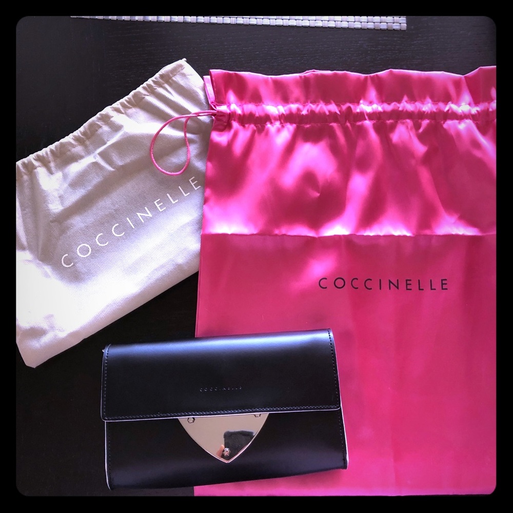 Coccinelle leather clutch with detachable strap.
